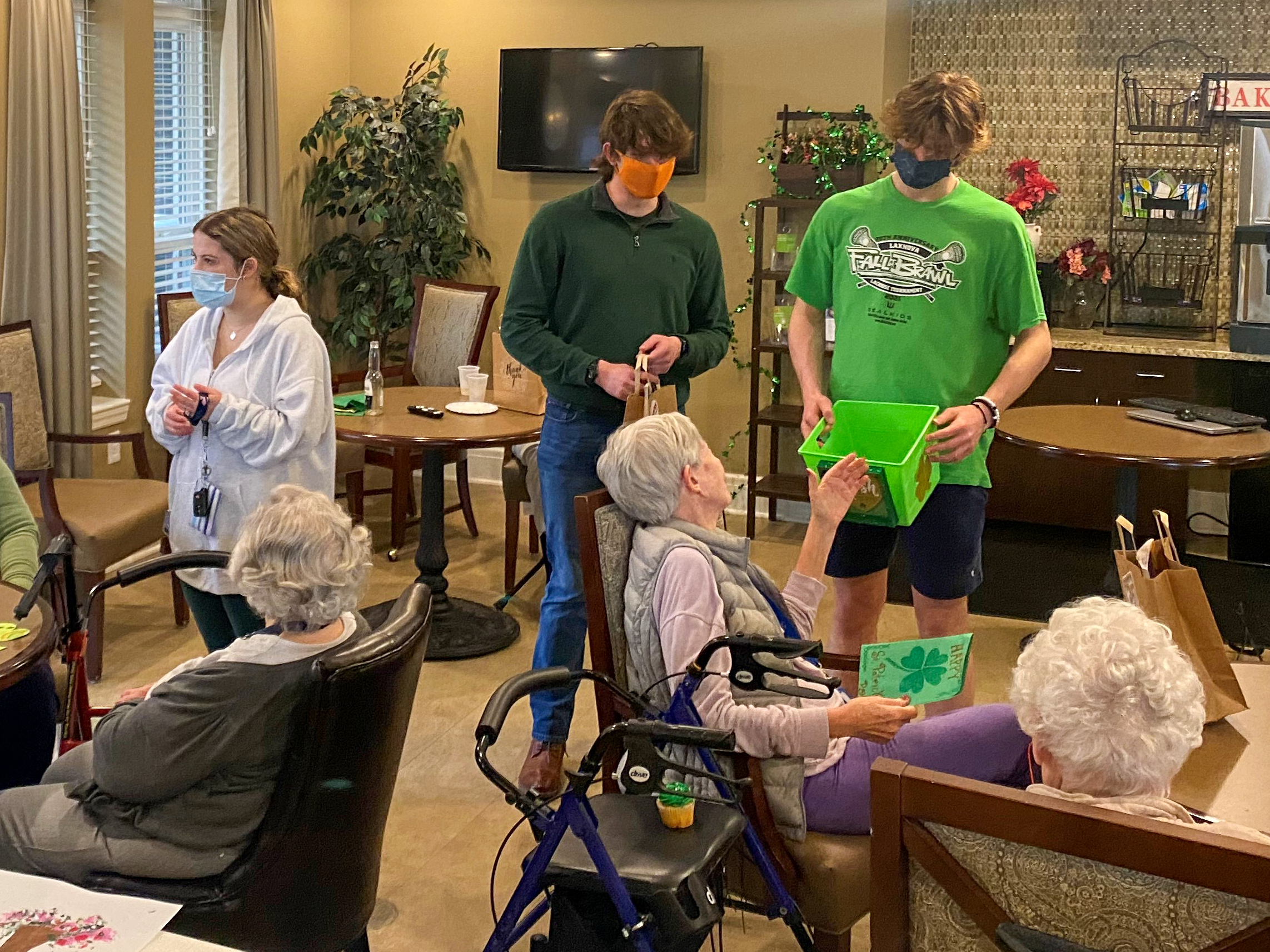 Members of South County High's Elder Outreach Club visit with local seniors they have corresponded with during the pandemic.