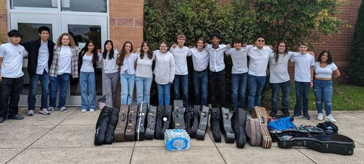 Guitar students getting ready to get on the bus to go downtown to the World Culture Festival