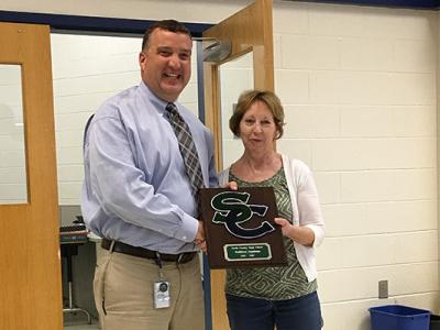 Mr. Pflugrath presents Ms. Landrum with a SC plaque.
